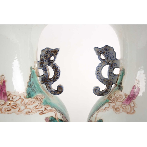 97 - A pair of large Chinese Famille rose porcelain baluster vases with pieced cloud handles. Probably la... 