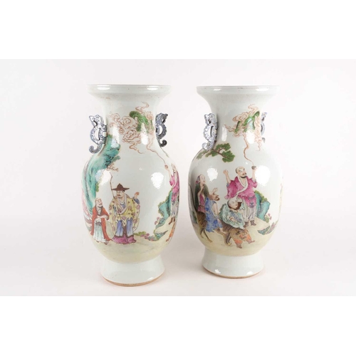 97 - A pair of large Chinese Famille rose porcelain baluster vases with pieced cloud handles. Probably la... 