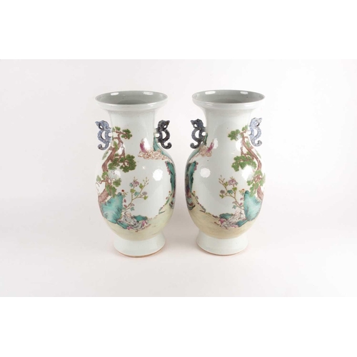97 - A pair of large Chinese Famille rose porcelain baluster vases with pieced cloud handles. Probably la... 