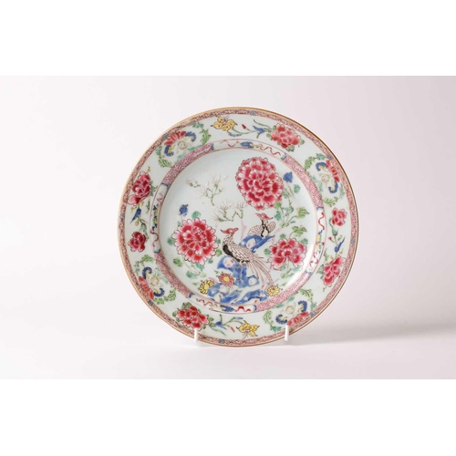 98 - § A Chinese famille rose plate, 18th century, painted in thick enamels with two pheasants upon rockw... 