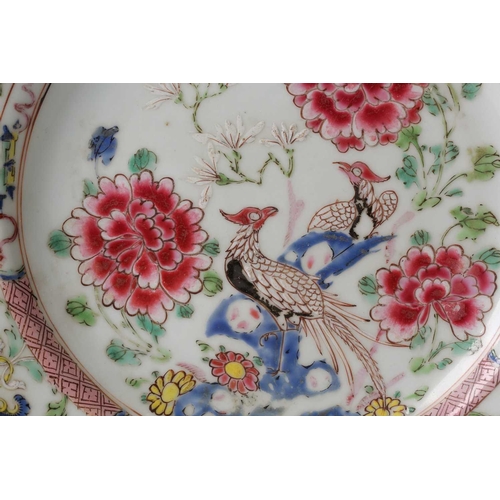 98 - § A Chinese famille rose plate, 18th century, painted in thick enamels with two pheasants upon rockw... 
