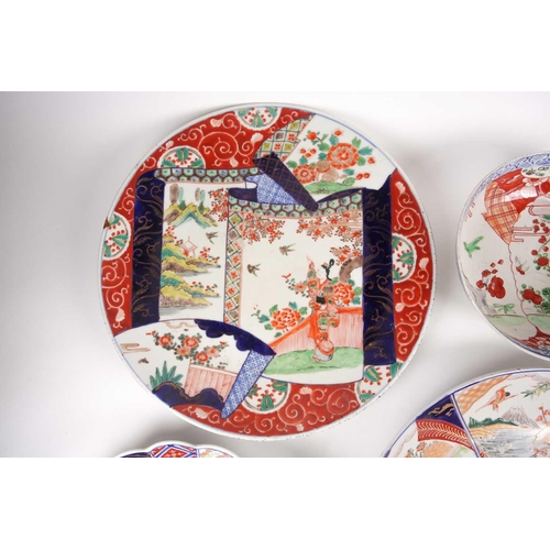 99 - A group of Japanese Imari & Kutani chargers, Meiji period, comprising a large charger, painted with ... 