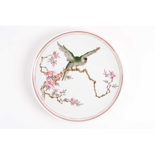 106 - A good Chinese porcelain plate, Republic period or later, finely painted with a green parakeet aligh... 