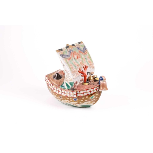 124 - A Japanese Kutani takarabune censer, circa 1910, the sail painted with a phoenix in stippled clouds,... 