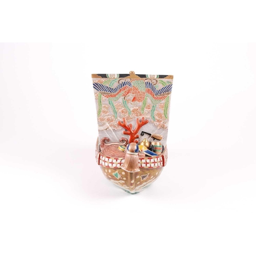 124 - A Japanese Kutani takarabune censer, circa 1910, the sail painted with a phoenix in stippled clouds,... 