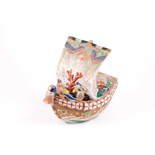 124 - A Japanese Kutani takarabune censer, circa 1910, the sail painted with a phoenix in stippled clouds,... 