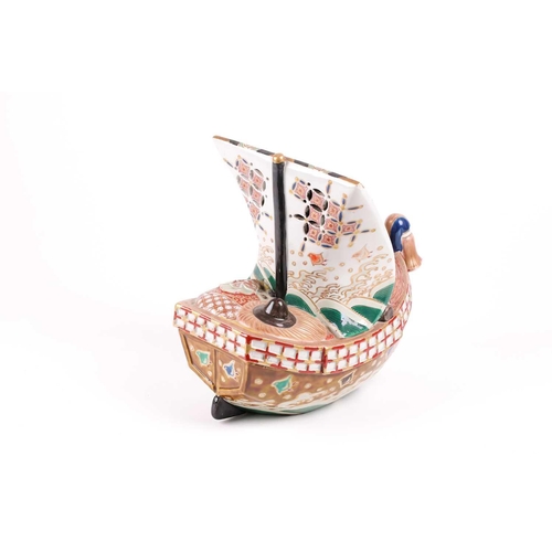 124 - A Japanese Kutani takarabune censer, circa 1910, the sail painted with a phoenix in stippled clouds,... 