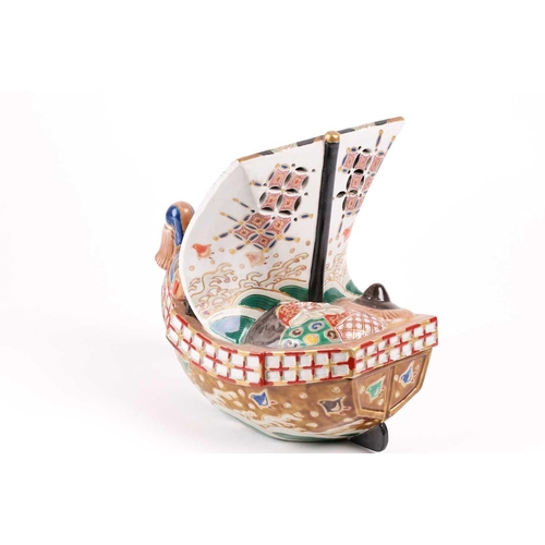 124 - A Japanese Kutani takarabune censer, circa 1910, the sail painted with a phoenix in stippled clouds,... 