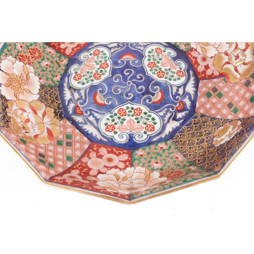 130 - A Japanese Imari porcelain decagonal dish, late Meiji period. Painted with alternating panels of sty... 