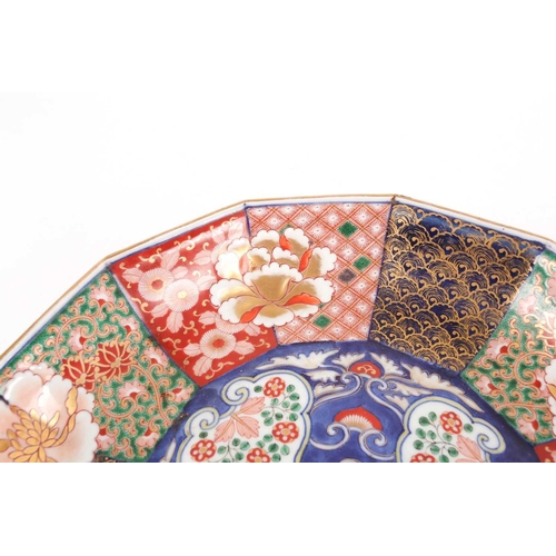 130 - A Japanese Imari porcelain decagonal dish, late Meiji period. Painted with alternating panels of sty... 