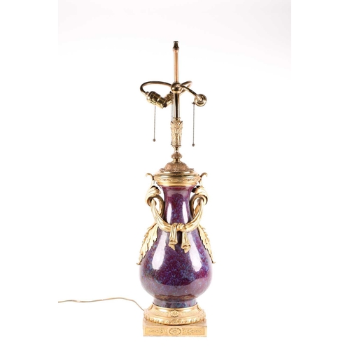 132 - A large Chinese flambe glazed vase with French ormolu mounts, the sang de boeuf glaze with lavender ... 