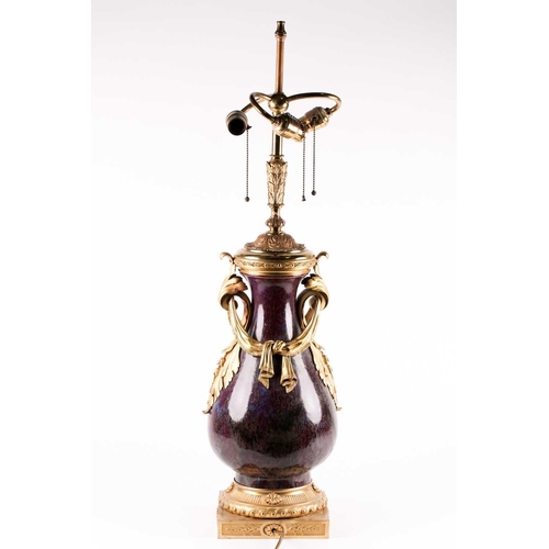 132 - A large Chinese flambe glazed vase with French ormolu mounts, the sang de boeuf glaze with lavender ... 