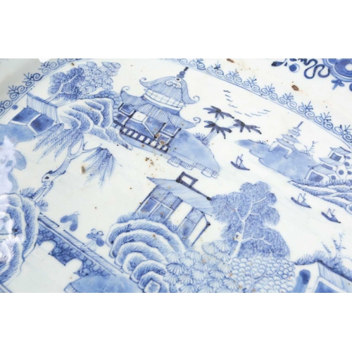 135 - Two Chinese blue & white export porcelain meat platters, late 18th century, each with landscape deco... 