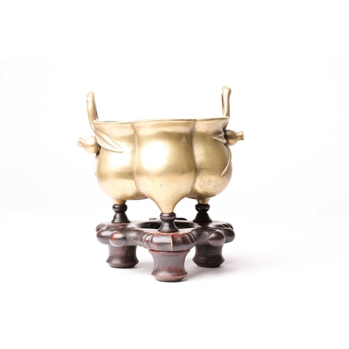 138 - A Chinese brass censer, late Qing, of hexagonal lobed form, with simulated bamboo handles terminatin... 