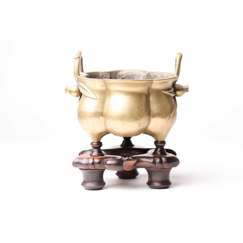 138 - A Chinese brass censer, late Qing, of hexagonal lobed form, with simulated bamboo handles terminatin... 