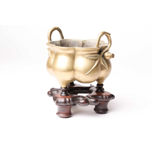 138 - A Chinese brass censer, late Qing, of hexagonal lobed form, with simulated bamboo handles terminatin... 