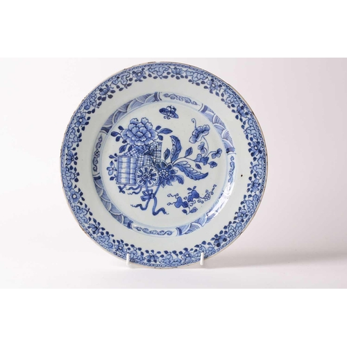 150 - § A Chinese blue & white porcelain plate, 18th century, painted with peony, gourds, a woven basket a... 