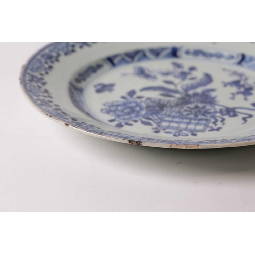 150 - § A Chinese blue & white porcelain plate, 18th century, painted with peony, gourds, a woven basket a... 