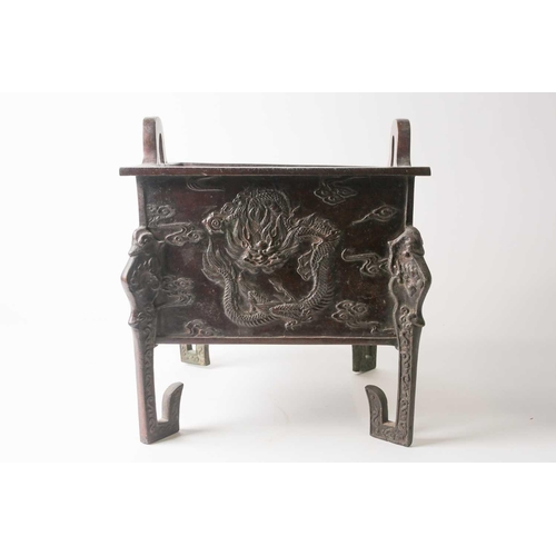153 - A large Chinese bronze Fang Ding, Qing, late 19th century, of square form with pierced loop handles,... 