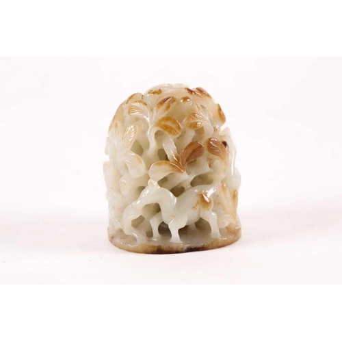 157 - A Chinese celadon and russet jade finial. Of oval domed form with carved and pierced decoration of b... 