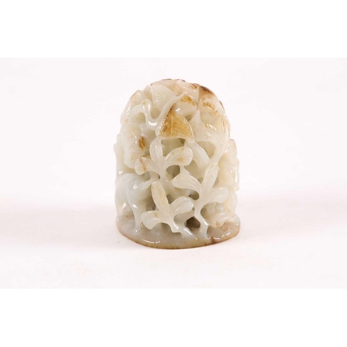 157 - A Chinese celadon and russet jade finial. Of oval domed form with carved and pierced decoration of b... 