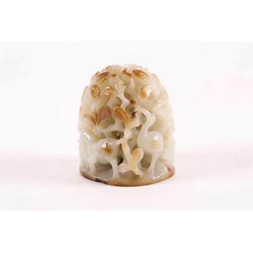 157 - A Chinese celadon and russet jade finial. Of oval domed form with carved and pierced decoration of b... 