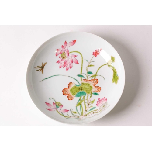 159 - A Chinese famille rose saucer dish, painted with lotus flowers and leaves and a dragonfly, pseudo si... 