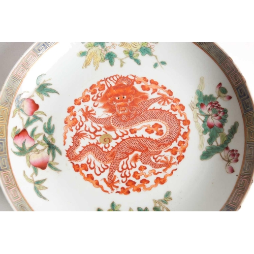 162 - A set of three Chinese Famille rose porcelain circular, dragon dishes. Qing dynasty. Each painted wi... 