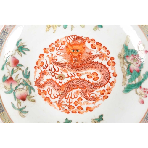 162 - A set of three Chinese Famille rose porcelain circular, dragon dishes. Qing dynasty. Each painted wi... 