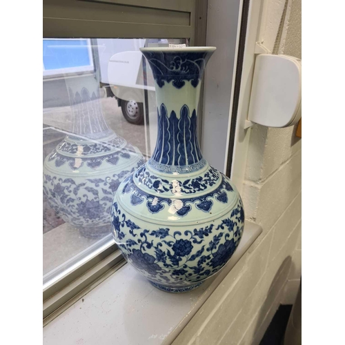 163 - A Chinese porcelain blue & white lotus vase, late Qing, the neck painted with waves above ruyi heads... 