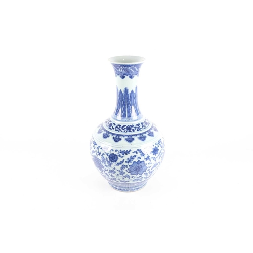 163 - A Chinese porcelain blue & white lotus vase, late Qing, the neck painted with waves above ruyi heads... 