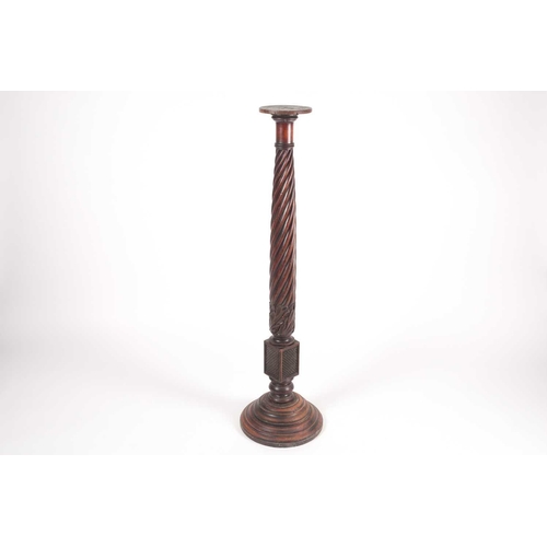 168 - A George IV carved and turned bedpost torchere with wrythen column. On turned conical base. 122 cm h... 