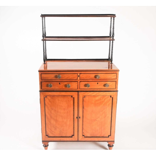 169 - A Regency ebonised and figured satinwood chiffonier with a fitted secretaire frieze drawer, with sup... 