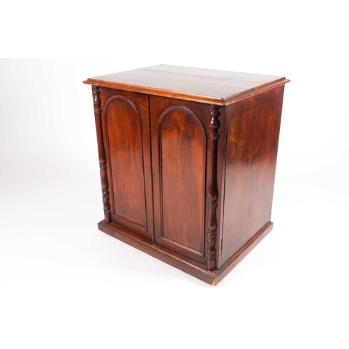 174 - A Victorian figured walnut freestanding collectors/ folio cabinet, with a pair of arched panel doors... 