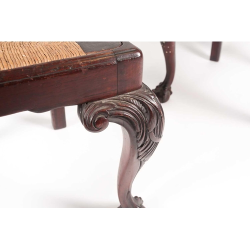 180 - A pair of 18th century American, Pennsylvanian 'Queen Anne' walnut side chairs, the splats pierced a... 