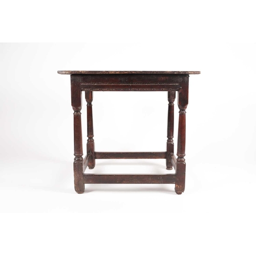 185 - A late 17th-century oak single drawer side table. With planked top. On turned spindle supports unite... 