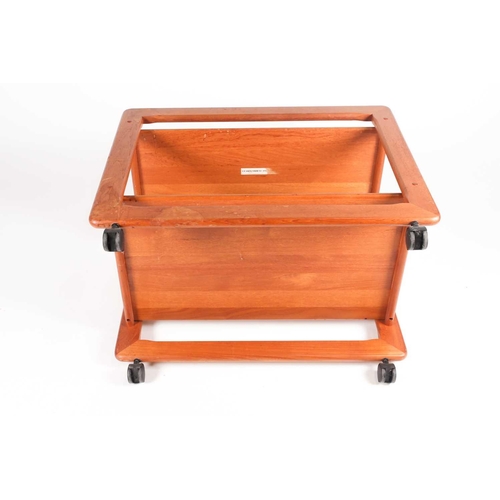 192 - A Danish teak trolley by Tarm Stole OG Mobelfabrik, mid 20th century, on black plastic castors, remn... 