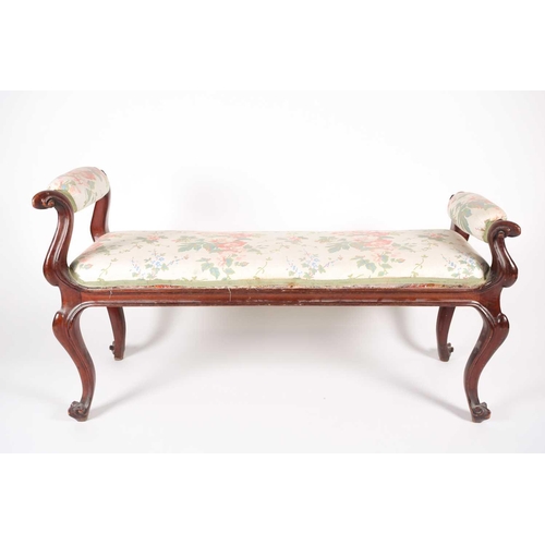 205 - A mid-Victorian carved mahogany duet stool, with scroll ends and stuff over upholstery, supported by... 