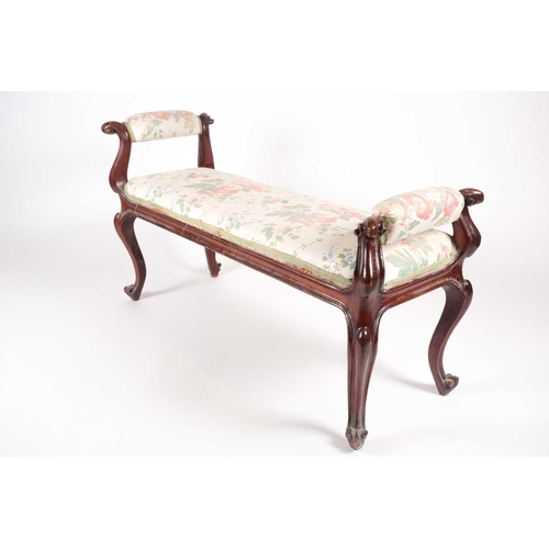 205 - A mid-Victorian carved mahogany duet stool, with scroll ends and stuff over upholstery, supported by... 