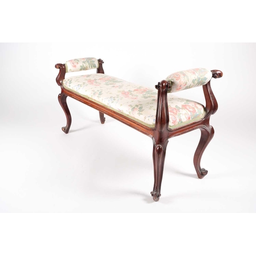 205 - A mid-Victorian carved mahogany duet stool, with scroll ends and stuff over upholstery, supported by... 