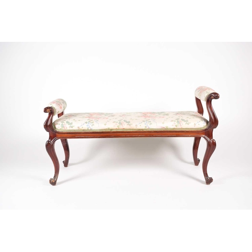 205 - A mid-Victorian carved mahogany duet stool, with scroll ends and stuff over upholstery, supported by... 