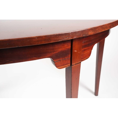 206 - A reconstructed George III mahogany dining table with central drawer leaf section joined by two demi... 