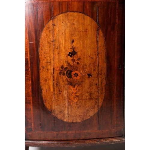 208 - A George III satinwood crossbanded mahogany bowfront two-door drawing room cabinet, the shaped doors... 