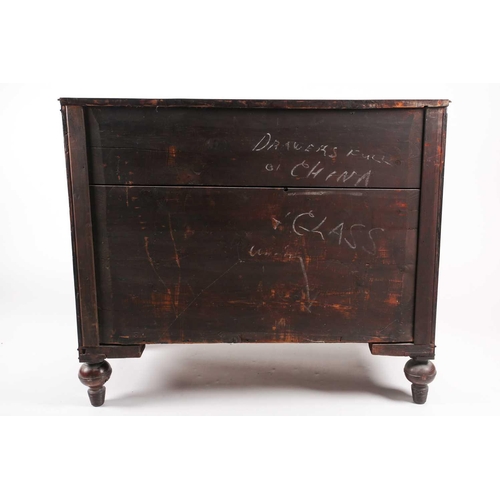 209 - A Regency figured mahogany break bow-fronted commode chest of three long drawers. The drawers flanke... 