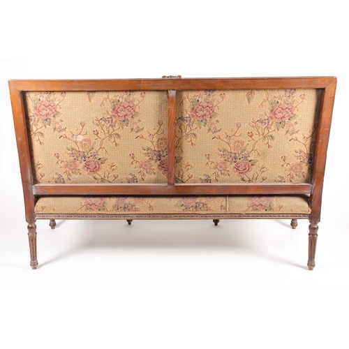 220 - An early 20th century, French Louis XVI style carved beechwood three seat sofa. With floral stuff ov... 