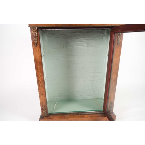 224 - A Victorian walnut and gilt metal mounted pier cabinet, the glazed door framed by inlaid strapwork d... 