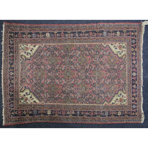 226 - A 20th century Lilihan? rug with a central lozenge field of stylized herat motif within multiple bor... 