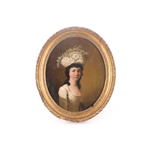 15 - An 18th century English school waist-length oval portrait of a lady with a floral headdress, oil on ... 