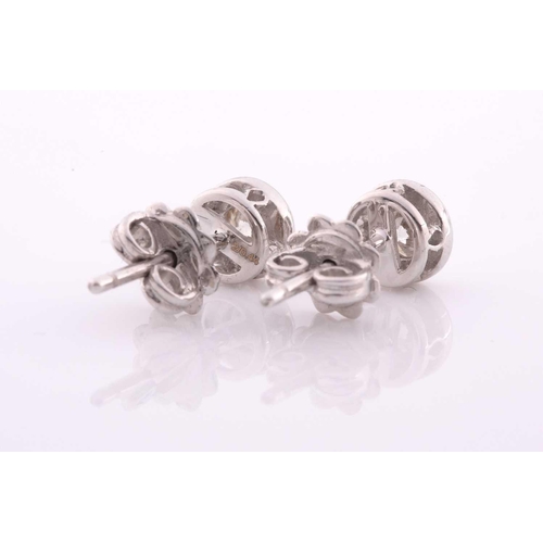 100 - A pair of collet-set diamond solitaire ear studs, set with round brilliant-cut diamonds of approxima... 