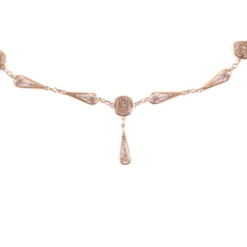 101 - A yellow metal and seed pearl drop pendant necklace, the pendants with filigree decoration and inset... 